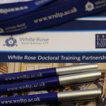Close up of WRDTP conference pack and branded pens