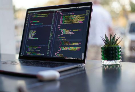 Laptop with code on a desk