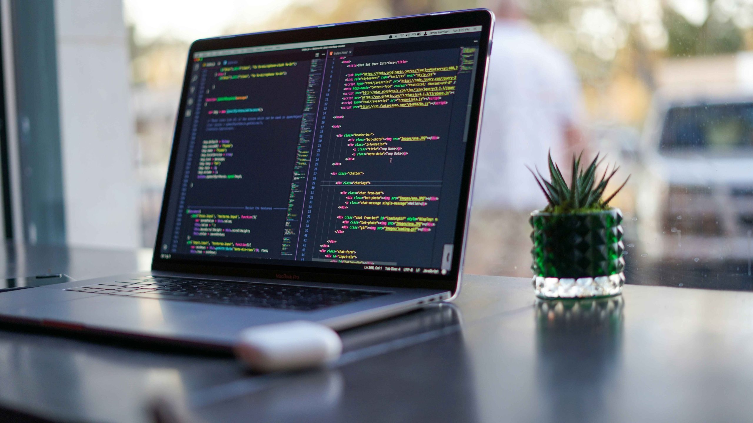 Laptop with code on a desk