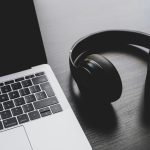 Headphones next to laptop